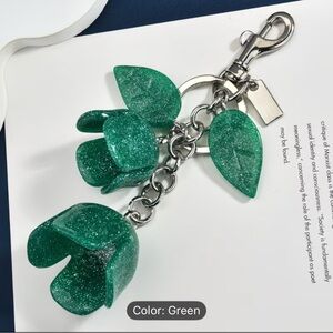 Glitter Flower Keychains/bag charms in Red, Green, and Pink.